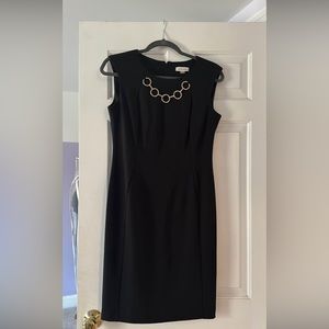 Calvin Klein black dress with gold chain trim. Size 8